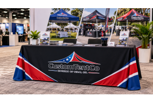 Custom tablecloth with a business logo displayed at a professional trade show booth